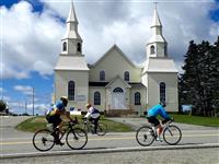 Cycling by Saint-Alphonse Church (Stacy Comeau)